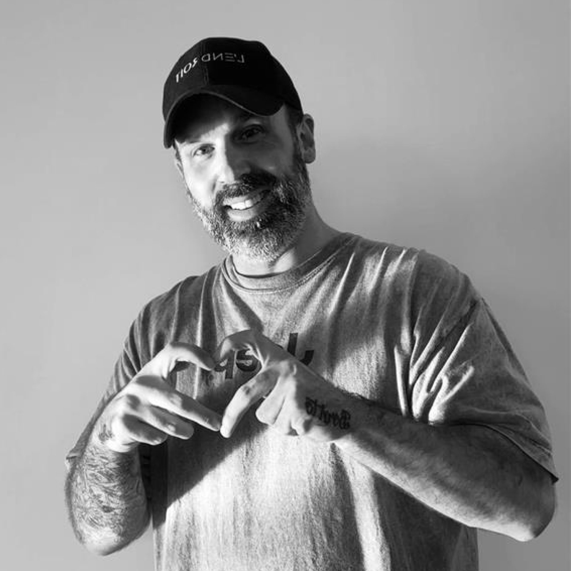 Éric Charpentier, L'Oréal Professionnel Portfolio Artist, throwing a hand heart sign